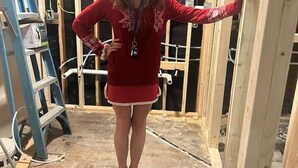 A person standing in a room under construction with exposed wooden beams and electrical wiring. - Beach House Kids & Pets OK Oct, Nov, Dec DISCOUNTED! AMIsland White Sand Beaches (Bradenton)