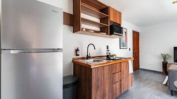 Fridge, microwave, stovetop, coffee/tea maker