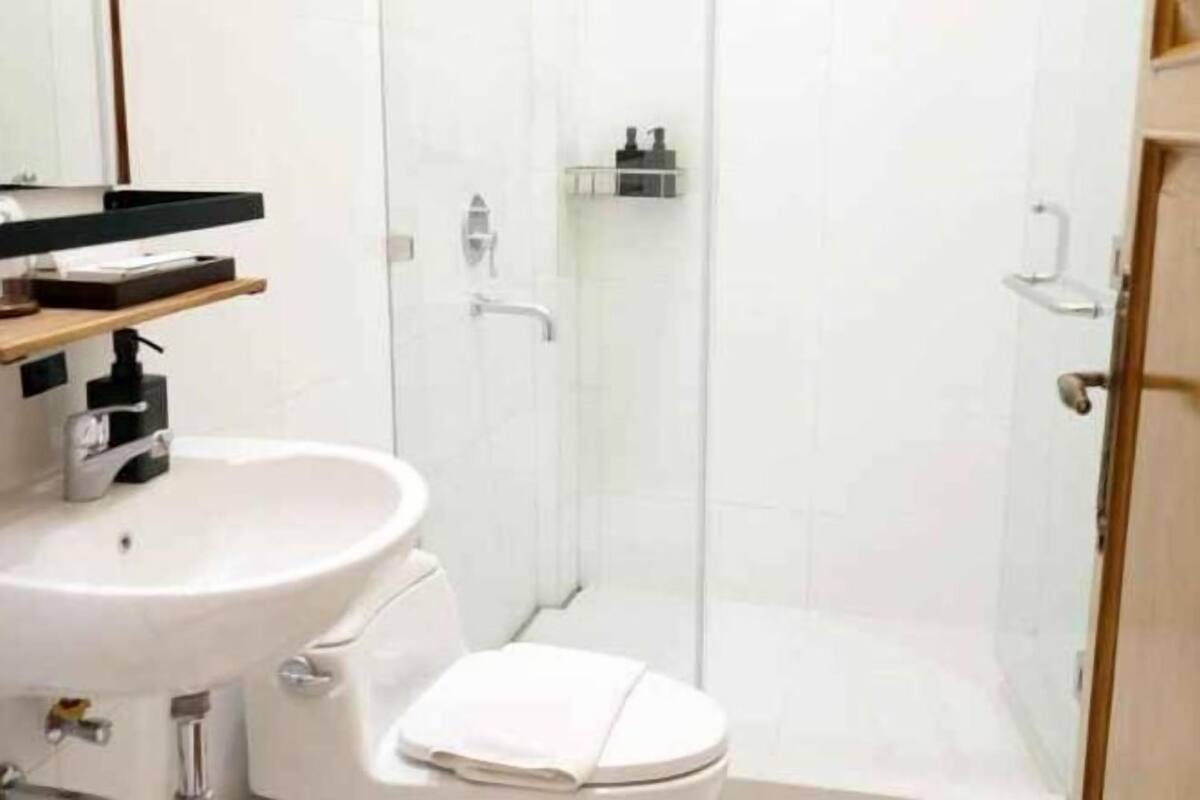 Bathroom | Shower, hair dryer, slippers, bidet