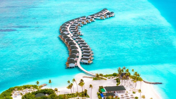 An overwater resort with a continuous walkway of overwater bungalows. - Joy Island  (Kasanfaru Island)