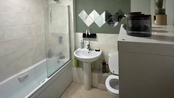 Combined shower/bathtub, deep-soaking bathtub, hair dryer, towels