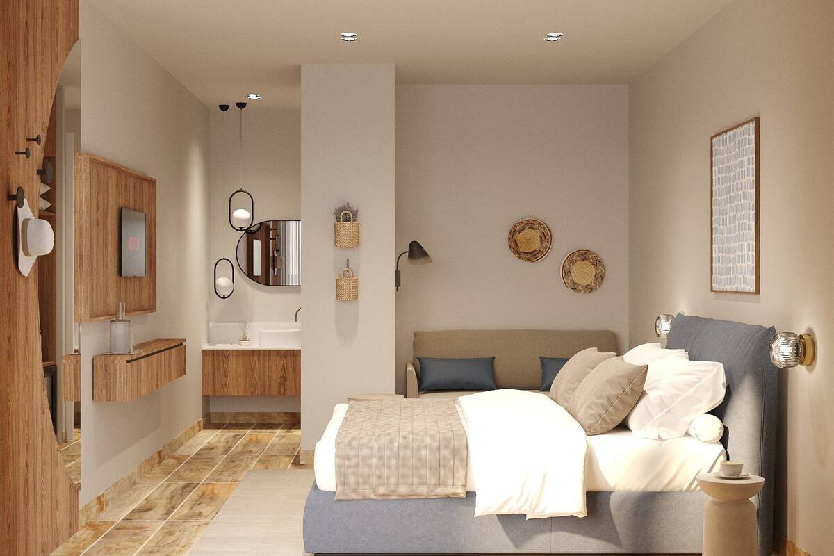 A modern bedroom with a bed, bedside tables, a nightstand, a built-in wardrobe, a mirror, and a bathroom with a sink and vanity.