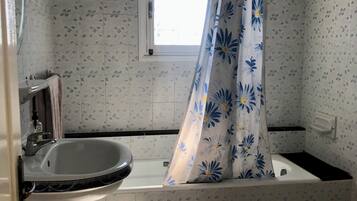 Shower, towels, soap, toilet paper