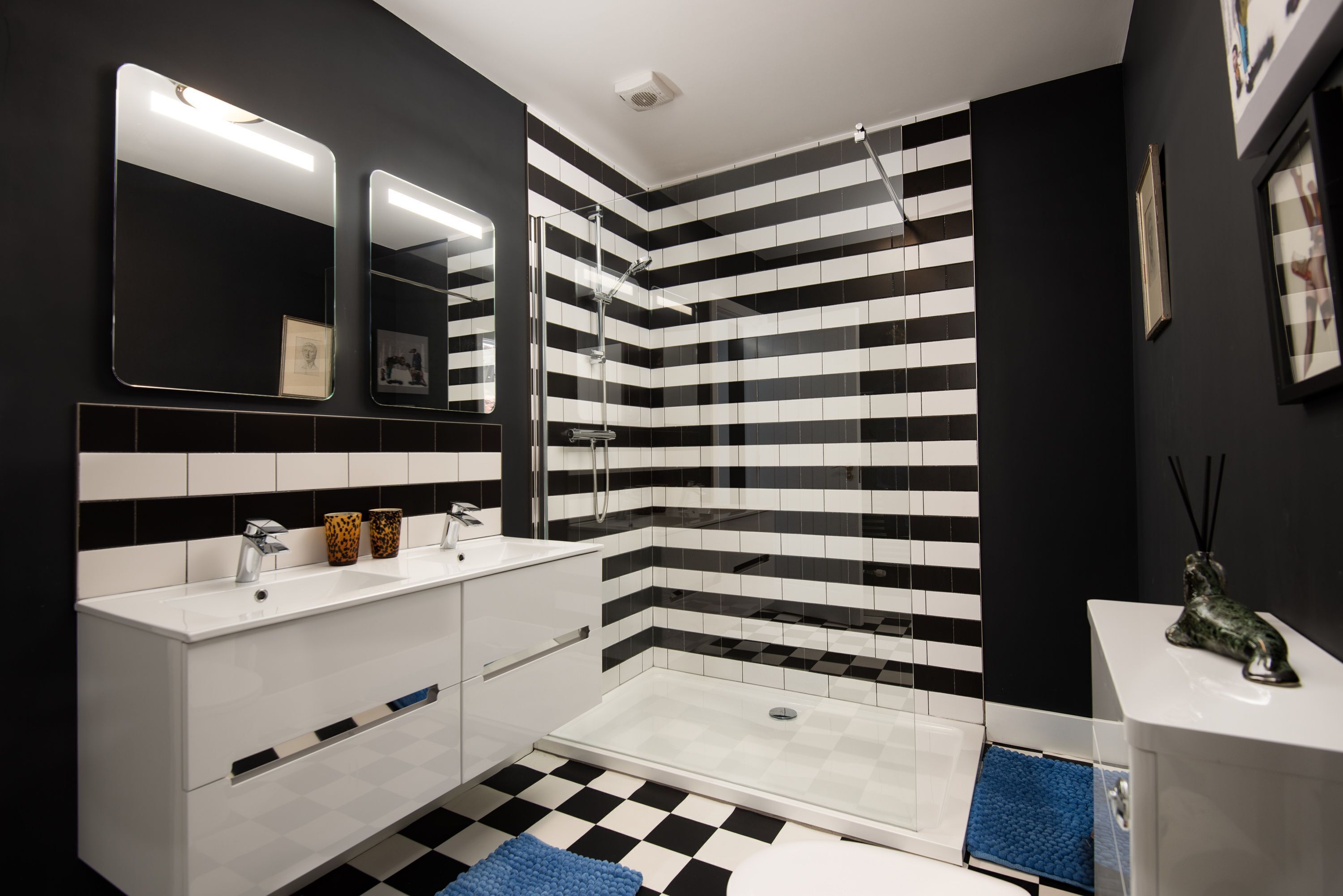 Bathtub, hair dryer, towels, toilet paper