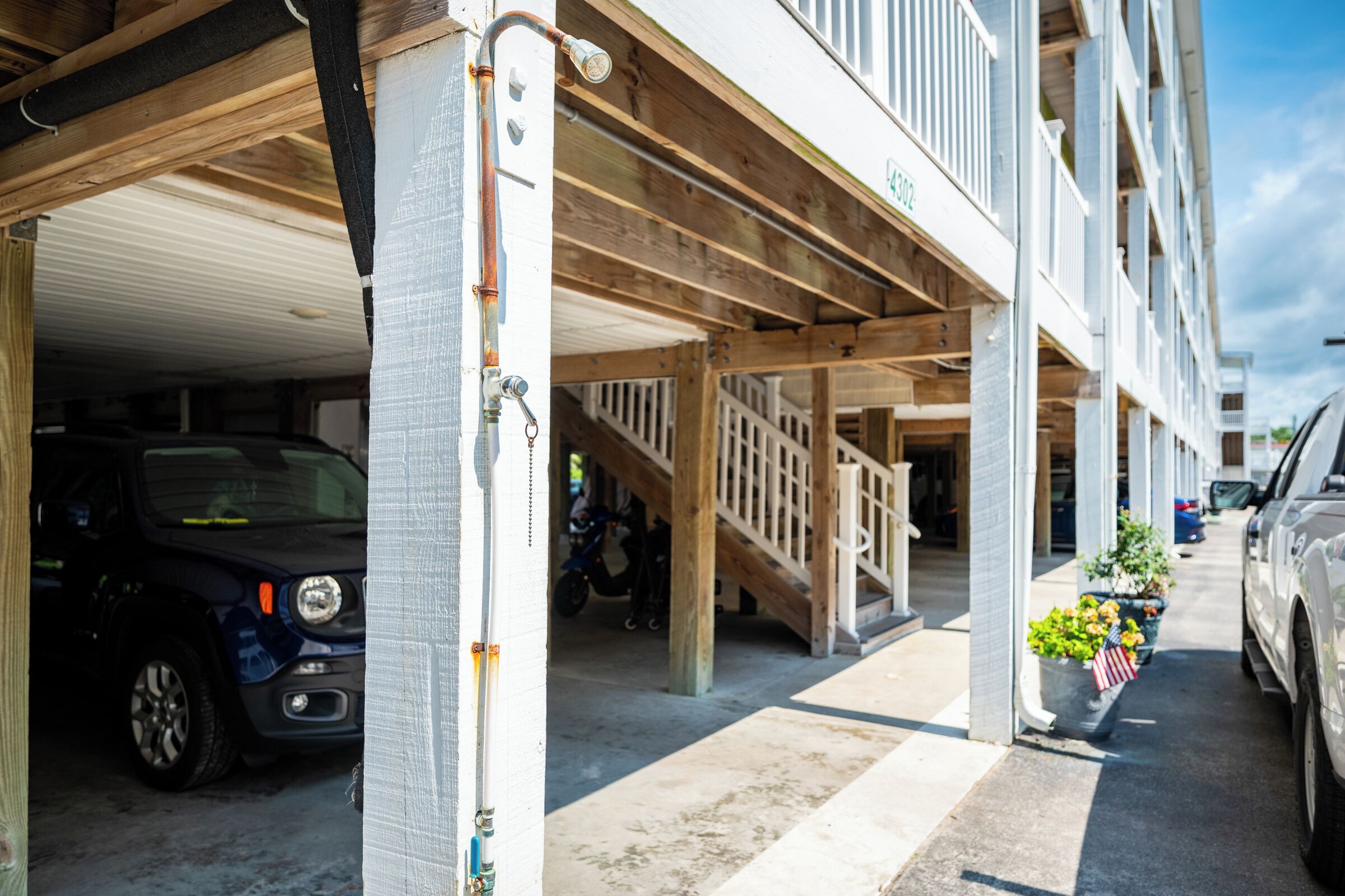 A multi-story parking garage with vehicles parked inside.