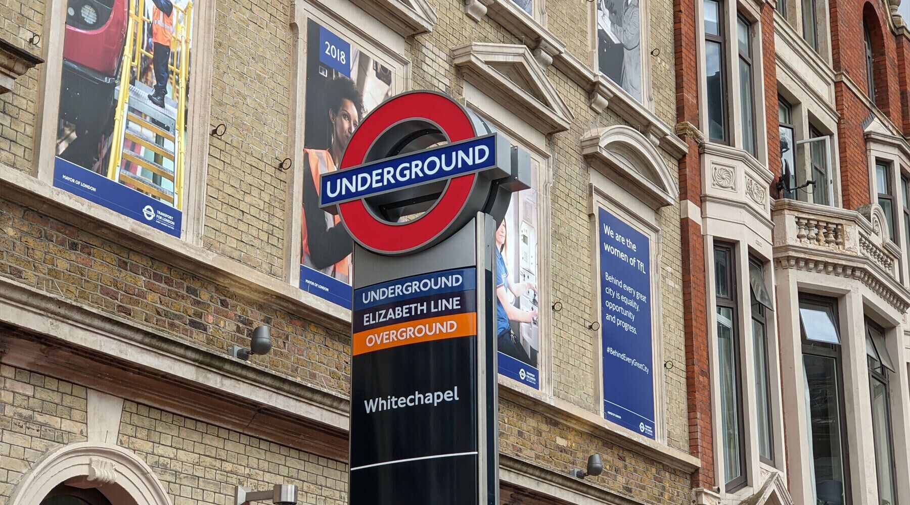 A London Underground sign with the Elizabeth Line and Overground routes.