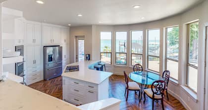 Luxury lake home with stunning water views, gourmet kitchen, hot tub & office