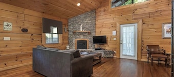 Cowboy cabin.  Modern log cabin spacious studio with HOT TUB that will take you back in time.