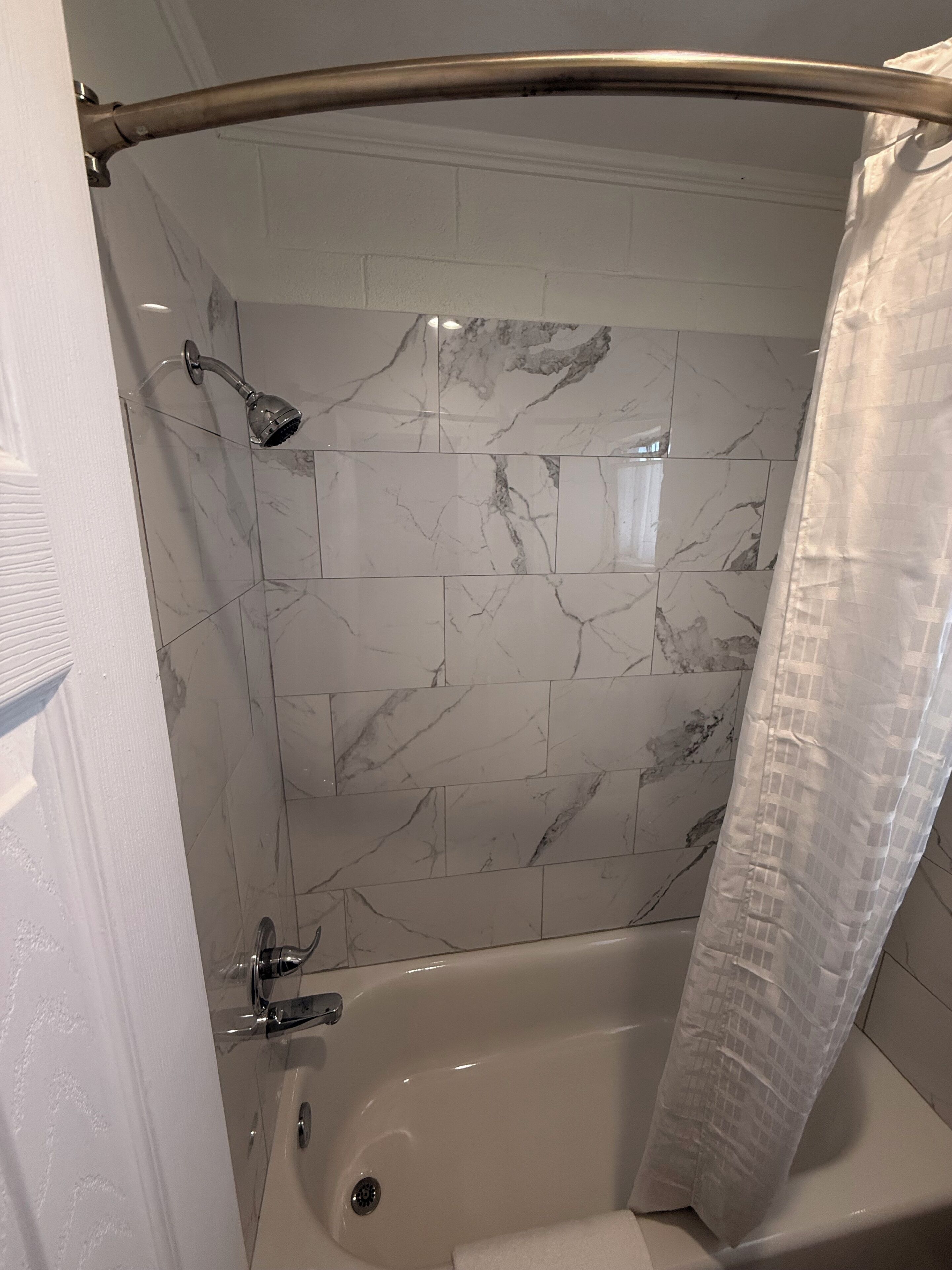 Basic Single Room | Bathroom | Shower, rainfall showerhead, towels, soap
