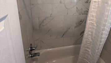 Basic Single Room | Bathroom | Shower, rainfall showerhead, towels, soap