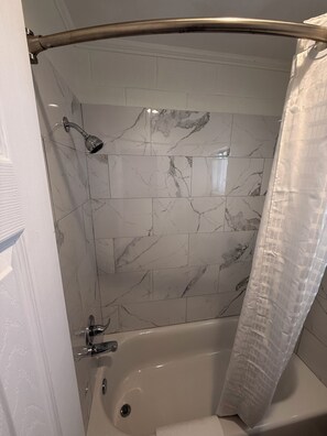 Basic Single Room | Bathroom | Shower, rainfall showerhead, towels, soap