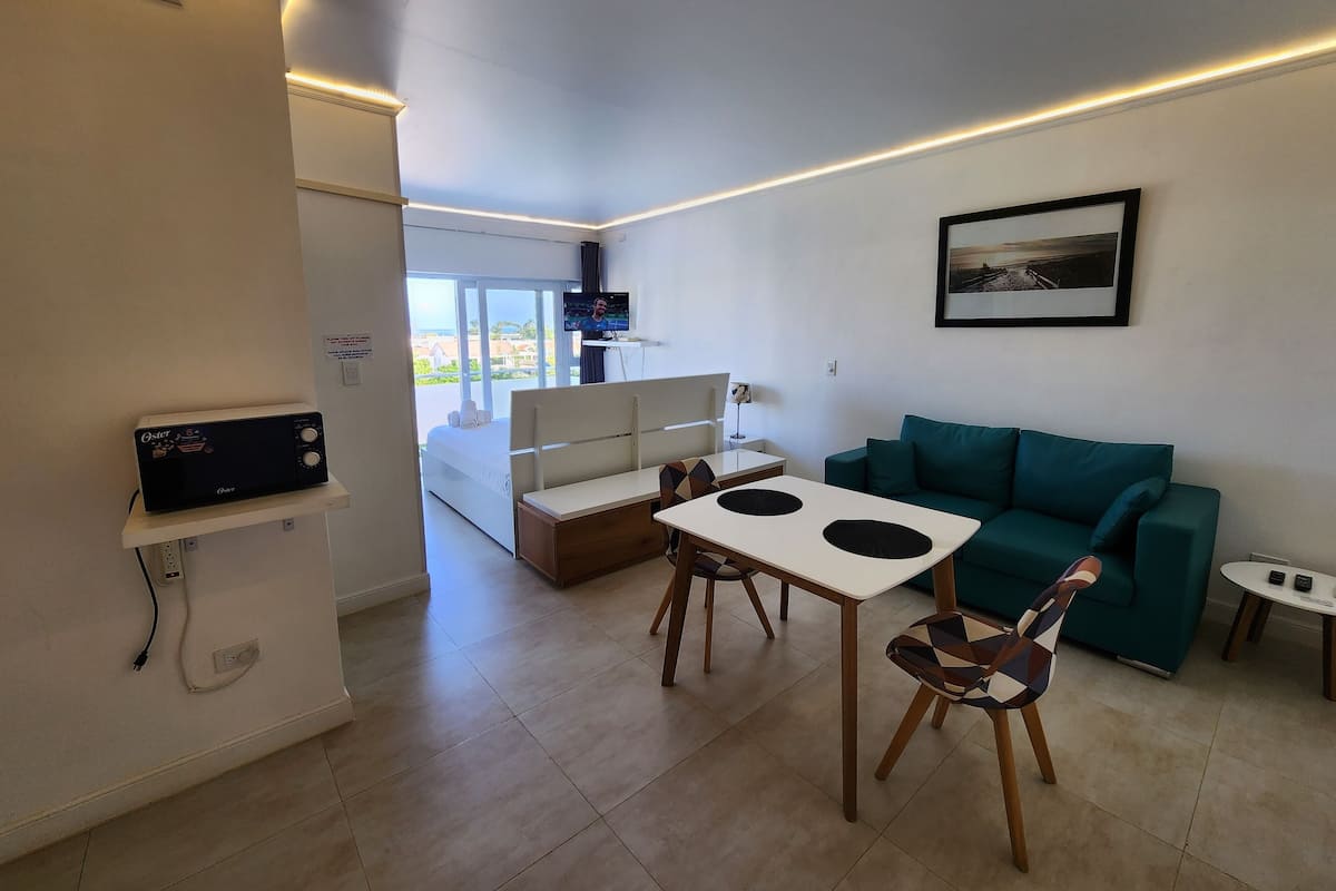 Panoramic Studio Suite | Living area | Smart TV, Netflix, streaming services