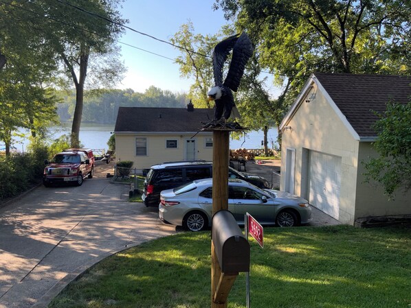 A mailbox with a red sign, a mailbox post, and a mailbox.