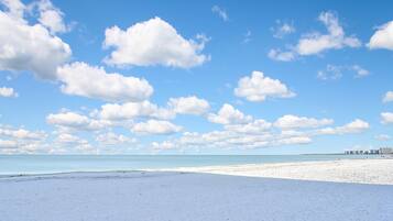 On the beach, sun loungers, beach towels