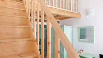 Habitación cuádruple Deluxe | Interior