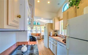 Enjoy cooking in the well-equipped kitchen with a stove and stainless steel appliances.