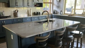 A kitchen with a large island, blue cabinets, and a window with blinds. - Winter getaway outside of Durango-  The perfect spot between Purgatory and town! (Durango)