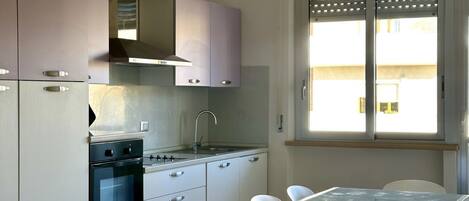Fridge, oven, dishwasher, dining tables