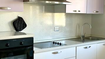 Fridge, oven, dishwasher, dining tables