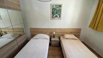 2 bedrooms, iron/ironing board, travel crib, bed sheets