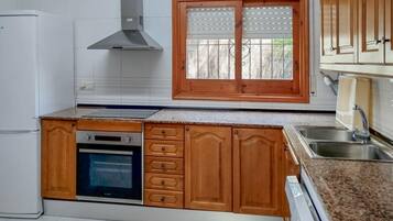 Fridge, stovetop, dishwasher, coffee/tea maker