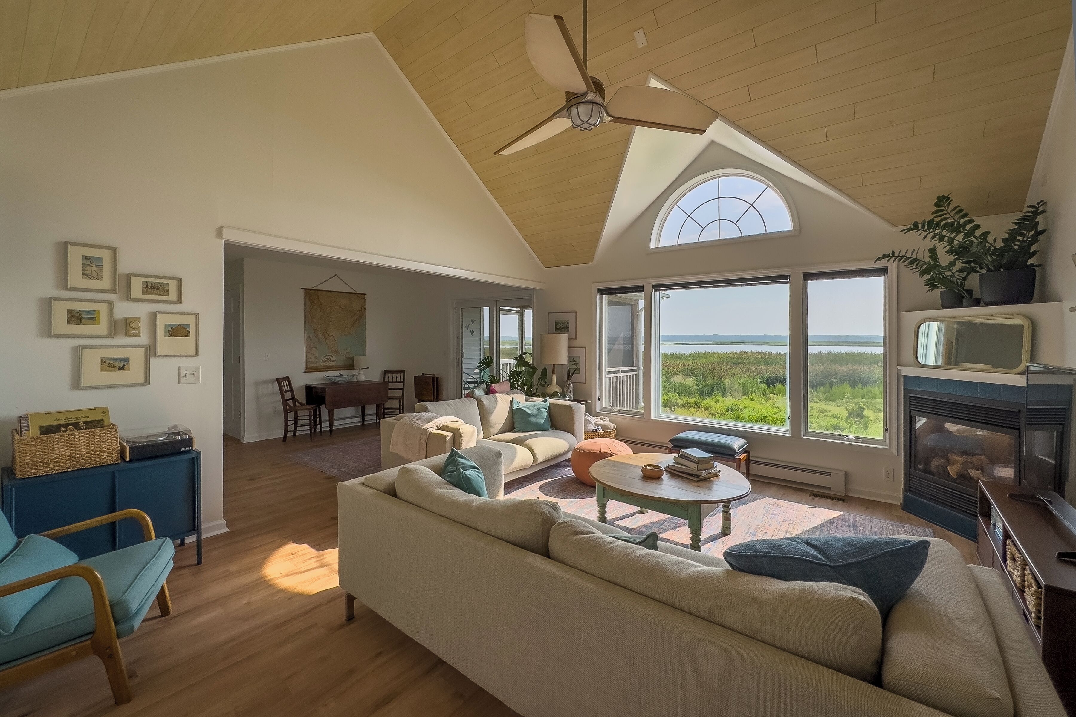 The living room leads to the porch behind the house. 