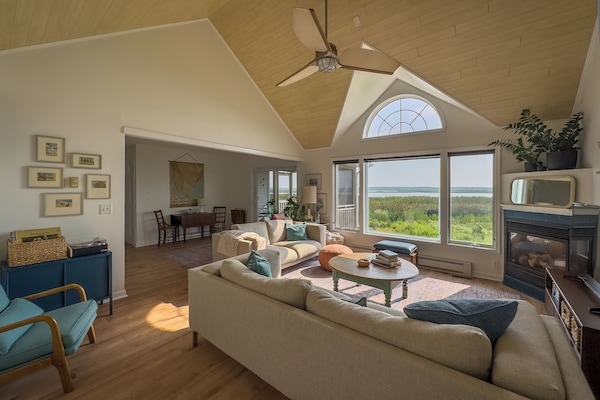The living room leads to the porch behind the house.