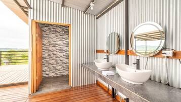 Shower, designer toiletries, hair dryer, towels