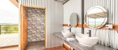 Shower, designer toiletries, hair dryer, towels
