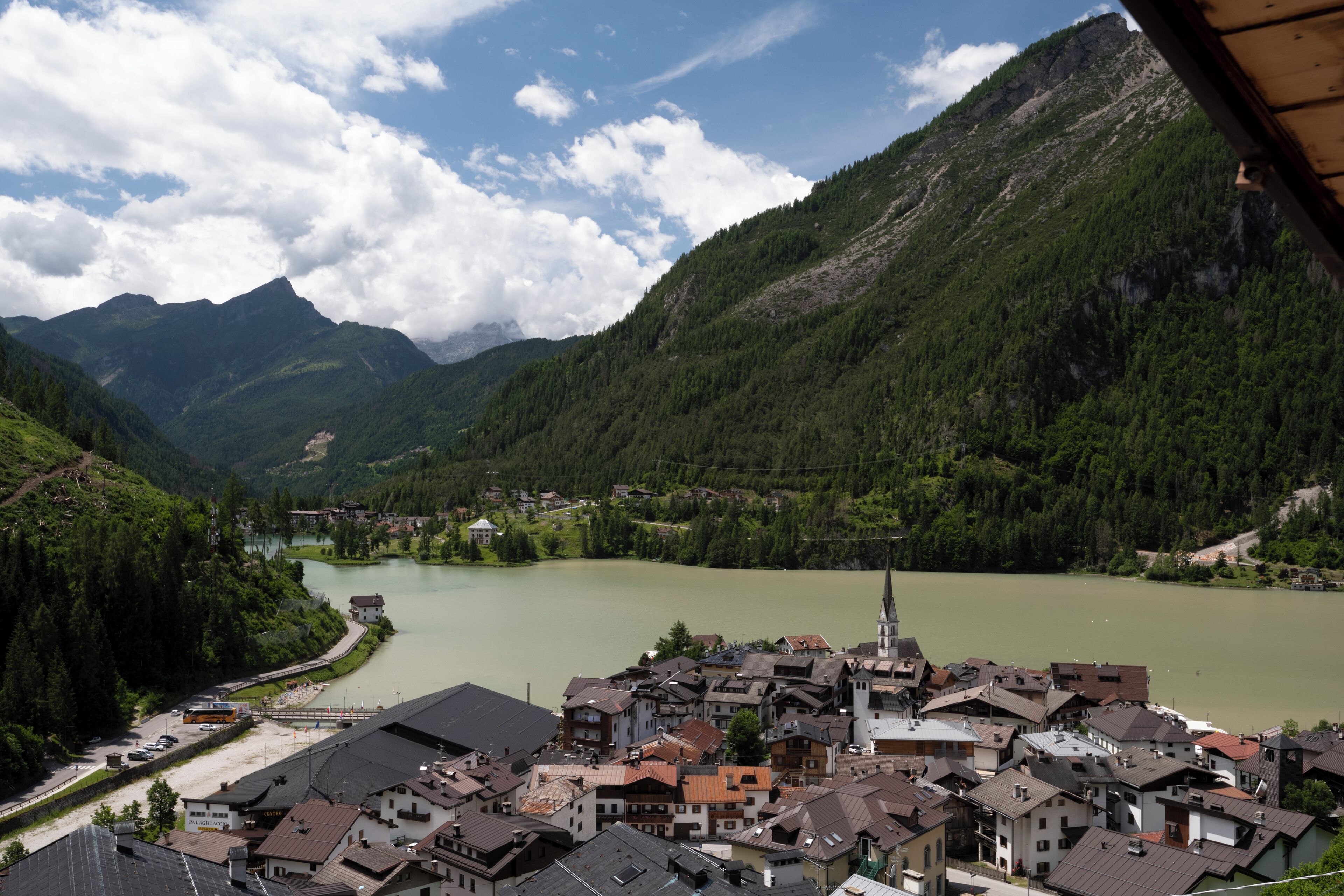 A town with a river, surrounded by mountains.