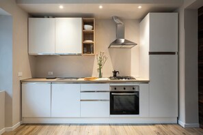 Standard Apartment | Private kitchen | Full-size fridge, microwave, oven, stovetop - SnowLake Suite & Apartments  (Alleghe)