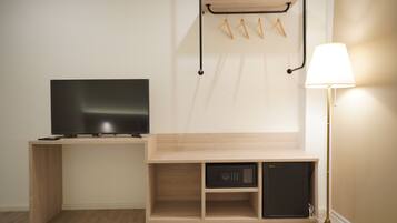 Deluxe Room | Living area | 23-inch Smart TV with digital channels, TV, Netflix