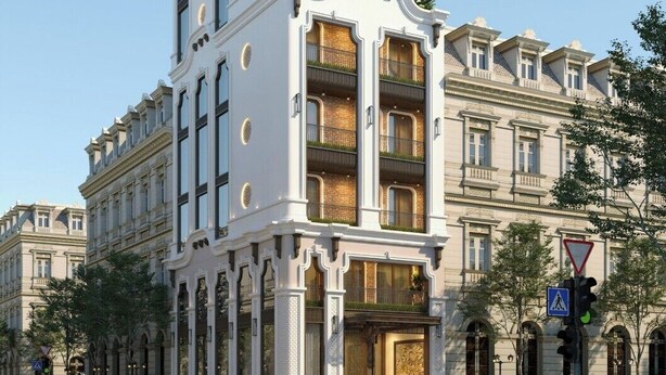 A multi-story building with a white facade, multiple balconies, and a classic architectural style. - Crescendo Boutique Studio  (Hanoi)