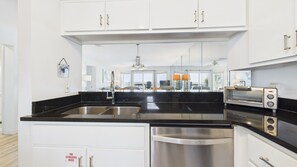 Enjoy cooking in this kitchen with stainless steel appliances, an oven, and a toaster oven.