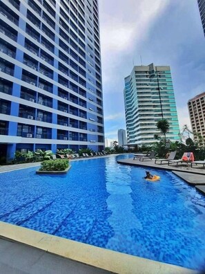 2 outdoor pools, open 6:00 AM to 10:00 PM, pool loungers - SMDC Air Residences Makati (Makati)