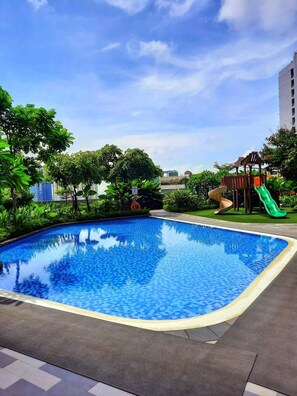 2 outdoor pools, open 6:00 AM to 10:00 PM, pool loungers - SMDC Air Residences Makati (Makati)