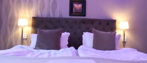 Premium bedding, down comforters, minibar, in-room safe