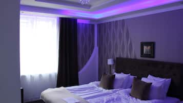 Premium bedding, down comforters, minibar, in-room safe