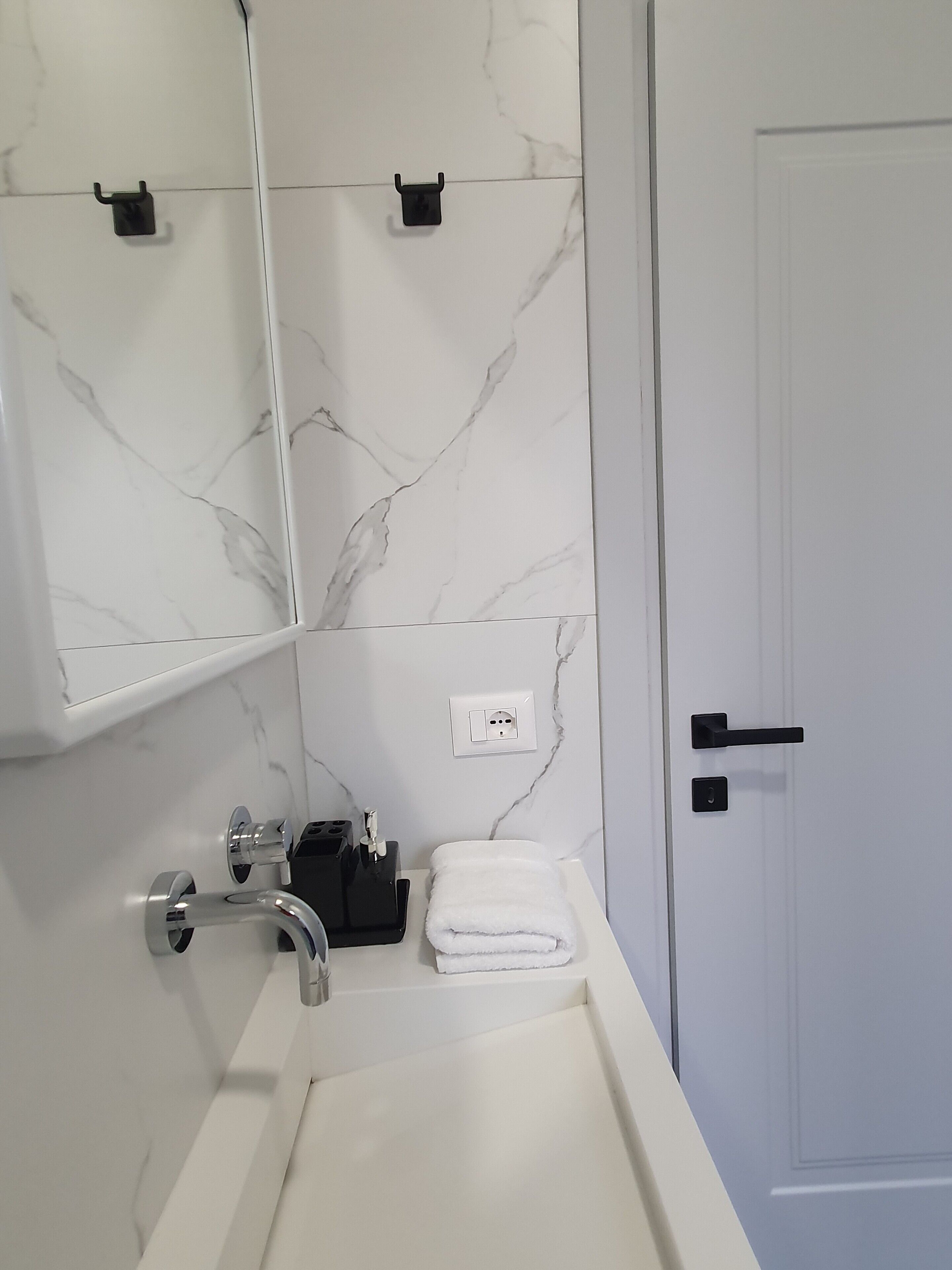 standard room | bathroom | shower, rainfall showerhead, hair dryer, slippers