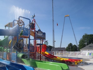 A water park ride with a pirate theme, including a shipwreck structure and a slide. - Waterfront Maine cottage! Next to Sebago Lake State Park! (Naples)