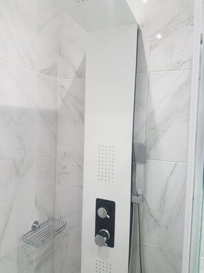 Shower, hair dryer, towels, soap