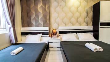 Habitación triple Deluxe | Wifi gratis y ropa de cama