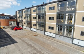 A multi-story residential building with large windows and balconies. - 1 bedroom awesome apartment in Fanø (Fanø)