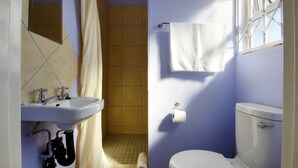 A bathroom with a sink, toilet, and shower. - Minilitha Lodge (Richards Bay)
