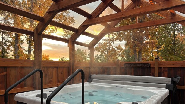 A hot tub with a wooden deck and a wooden fence labeled "MOONSHADOW". - Abundant Activities for Adventures People (Goldendale)