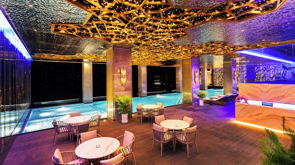 Indoor pool, open 8:00 AM to 10:00 PM, pool loungers
