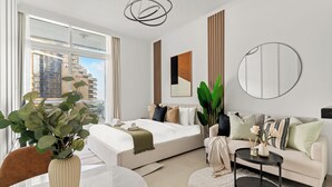 A modern hotel room with a bed, a sofa, a dining table, and a large window with a city view. - Silkhaus Botanica Tower, Dubai Marina (Dubai)