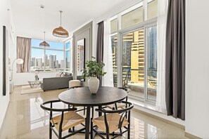 Standard Apartment | Living area | 50-inch Smart TV with digital channels