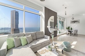Deluxe Apartment | Living area | 50-inch Smart TV with digital channels
