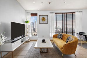 Burj Views B 2604 | Living area | 50-inch flat-screen TV with cable channels - Silkhaus Burj Views, Downtown Dubai (Dubai)